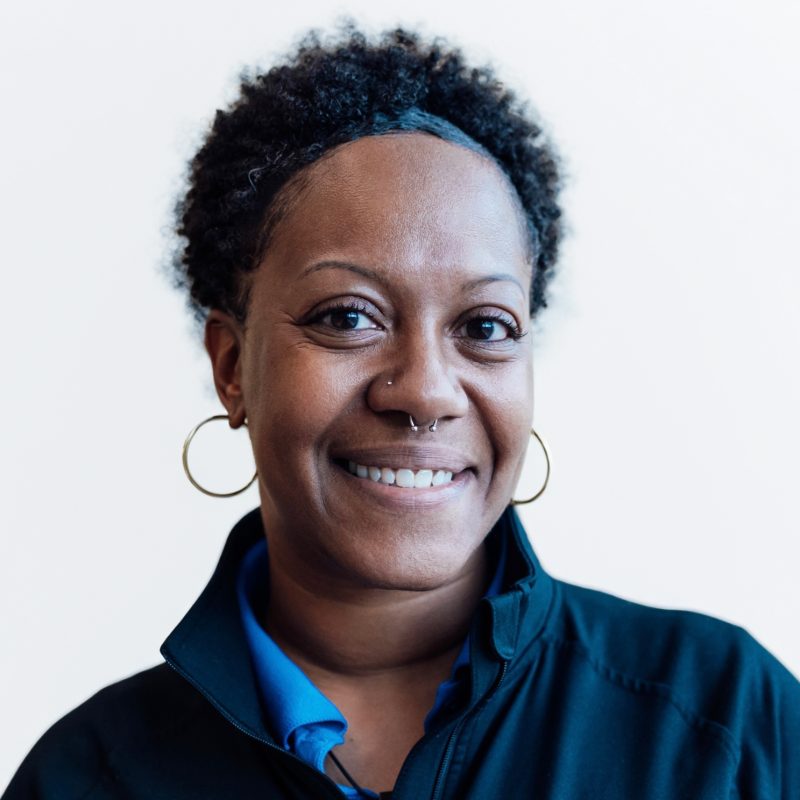 Owner & CEO Basya Miller in White Studio Portrait